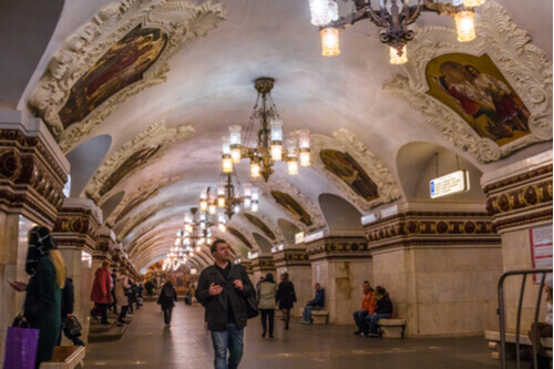 Tourists take in the stunning interiors of the Moscow Metro Station.