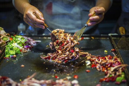 Spicy squid is a common dish found in the old town of Lijiang.