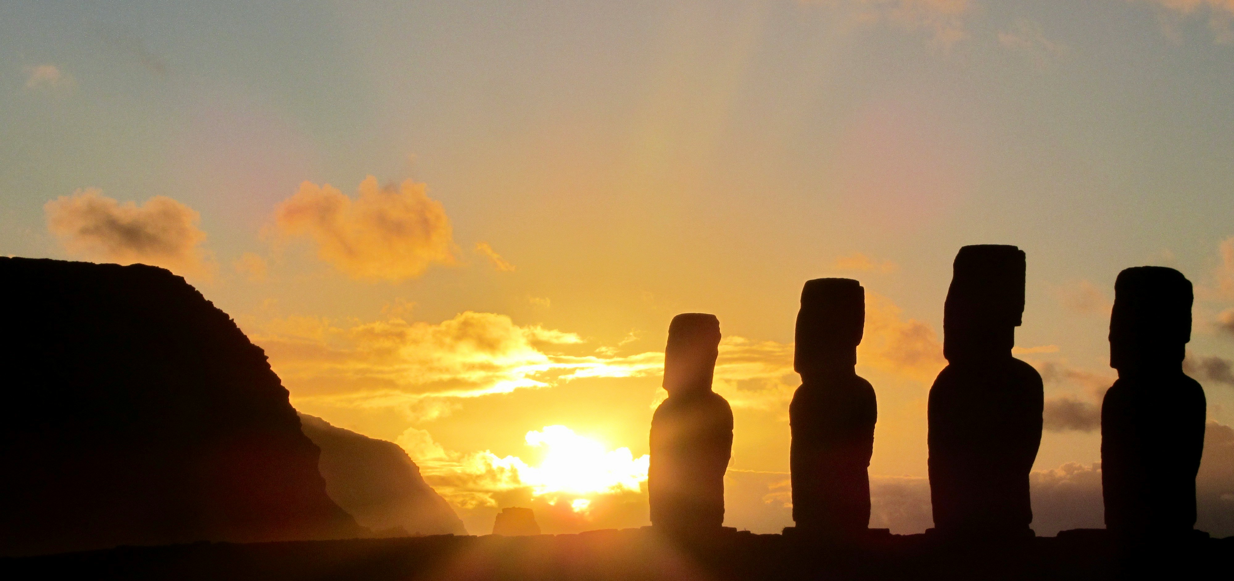 Moai silhouetted at sunset on Easter Island