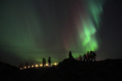 Visitors braving the cold to watch the Northern Lights in Tromso