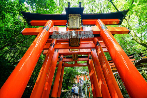 A close-up of the large red Torii Gate in Fushimi Inari, Kyoto, Japan.