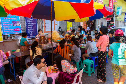 Bogyoke Aung San Market, formerly Scotts Market, with locals eating in the Pabedan township.