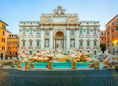 The well-visited Trevi Fountain in the morning light.