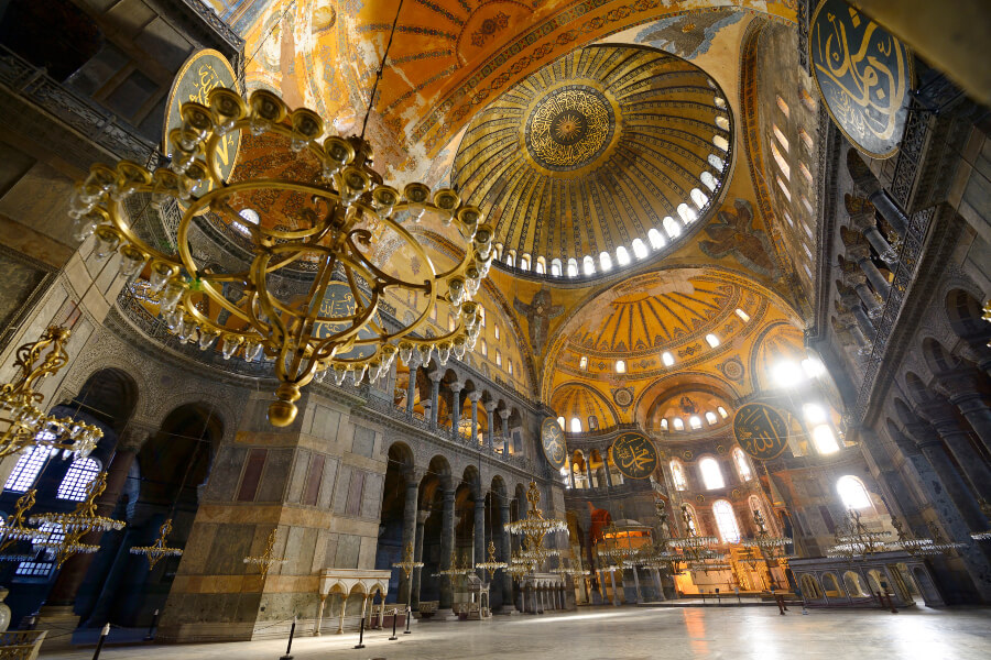 Morning light seeps through the golden dome of the Hagia Sophia.