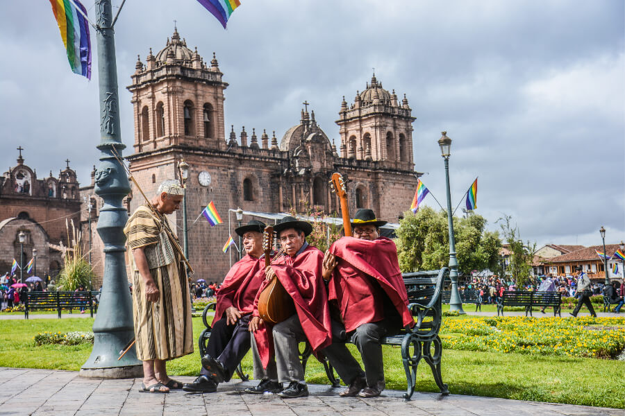 Performers rest at Plaza de Armas during the Inti Raymi festival in Cusco