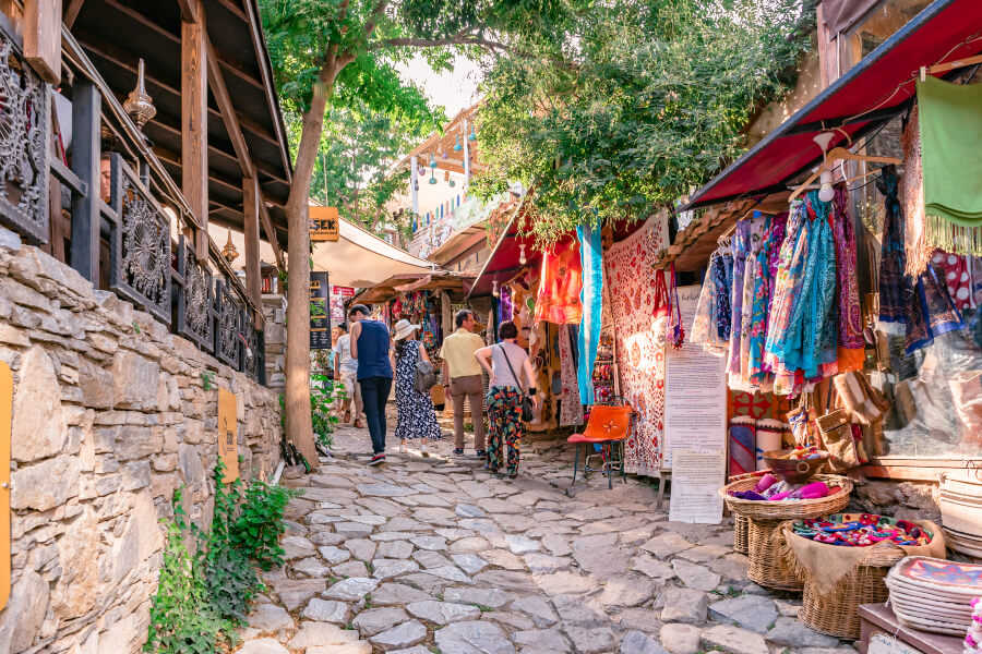 Tourists window shopping along the market place in Sirince Village.
