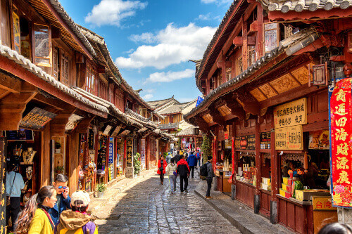 Tourists exploring the old town of Lijiang.