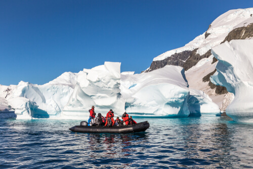 Travellers enjoying the icy landscapes on an Antarctica tour