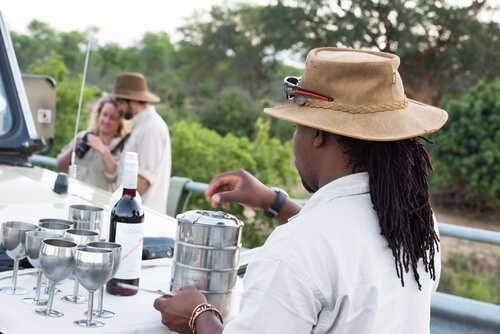 When on safari in Africa, tour guides supply visitors with amenities such as drinks and snacks.