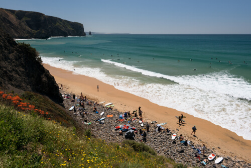The relaxing Aljezur surf beach in Portugal welcomes tourists and locals alike.