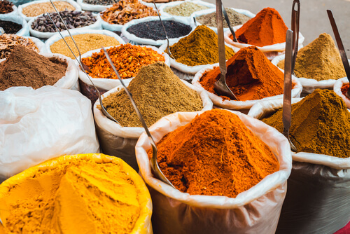 Colourful, aromatic spices are sold in a local market.