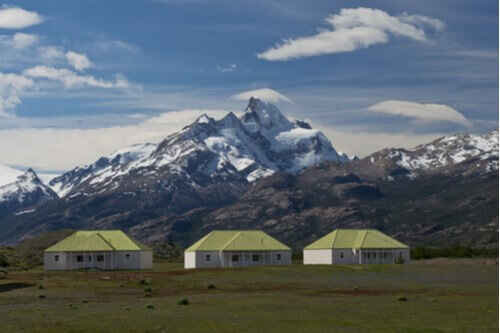 Estancia in Patagonia against the backdrop of mountains.