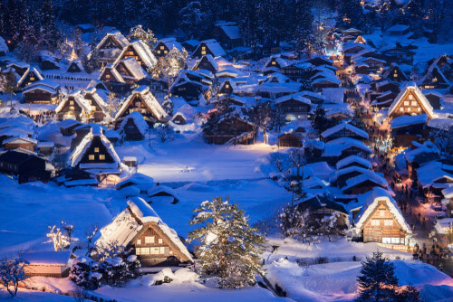 The snowy huts of Shirakawago in winter.