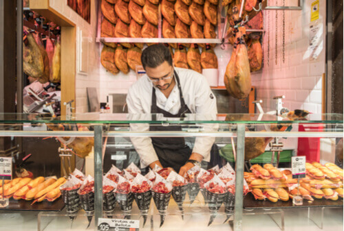 Delicious food is available for purchase in a Madrid Market Stall, Spain.