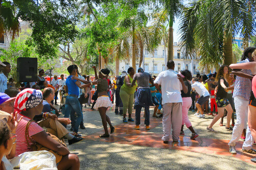 People dance salsa in one of Havana's central squares.