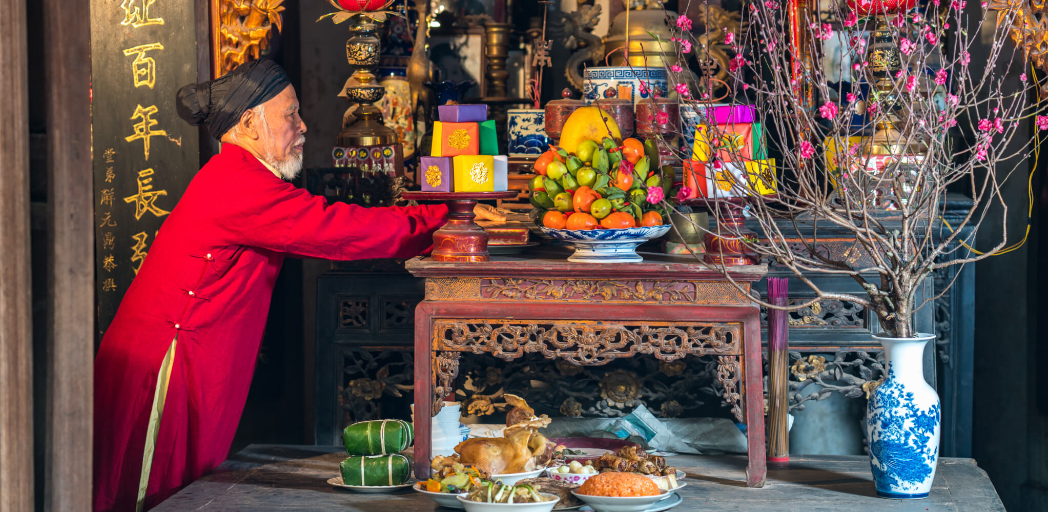 Preparing the altar with offerings for the final meal of the year, a key part of Vietnam's Tet celebrations