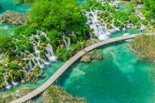Tourist on the boardwalk in Plitvice National Park.