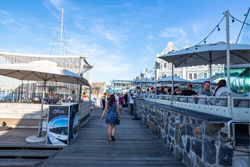 Cape Town harbor in Victoria and Alfred Waterfront at sunset with Alba floating restaurant in South Africa