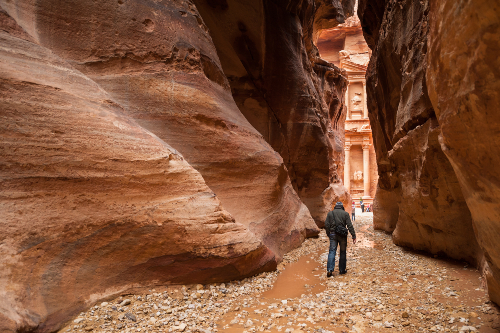 A lone tourist walking to the Treasury in Petra, Jordan.