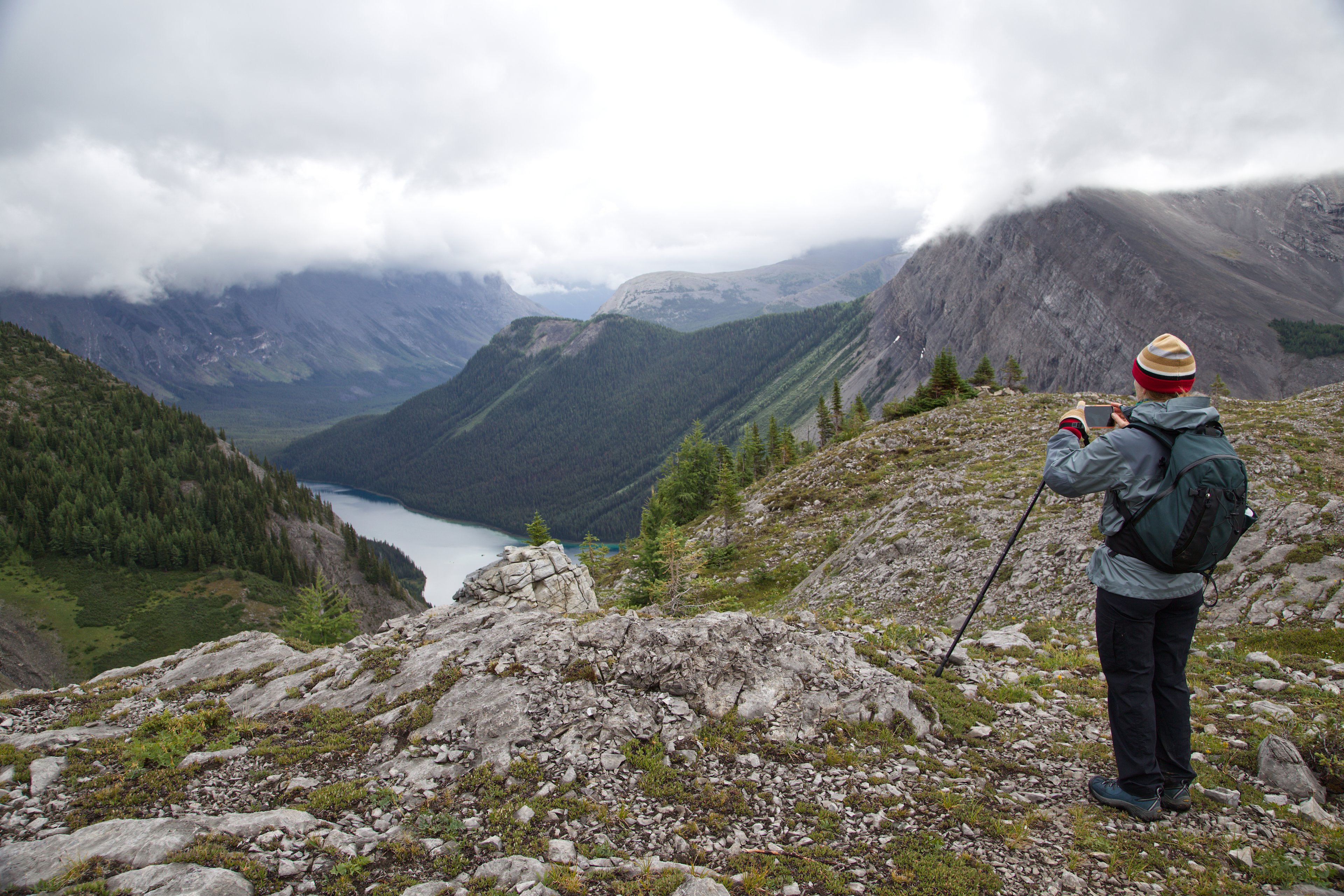 A hiker captures the stunning scenery of the Rocky Mountains
