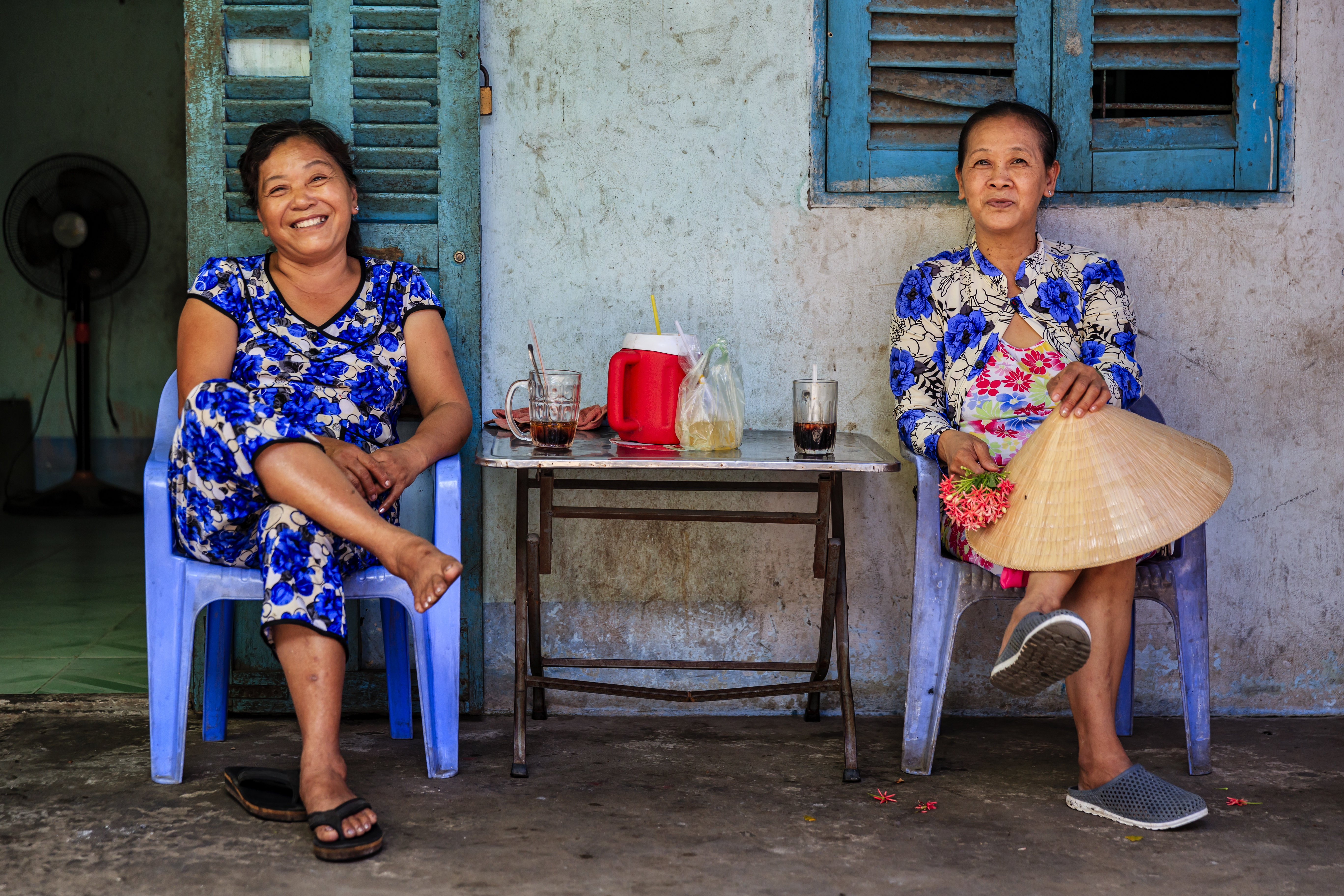 Two Vietnamese women coffee together in the serene Mekong River Delta