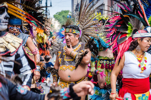 Aztec dancers dancing in Zocalo Square, Mexico City.