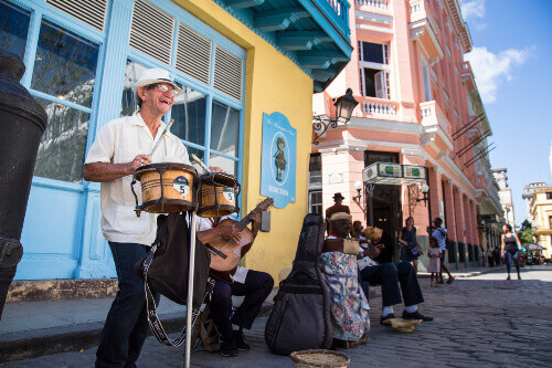 Musicians playing traditional Cuban music beside the Ambos Mundos Hotel where Ernest Hemingway once stayed.