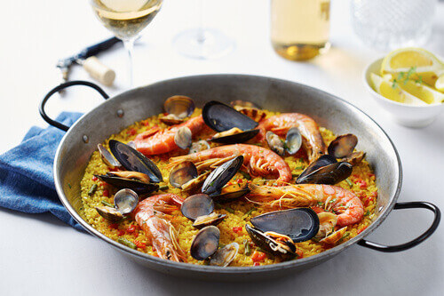 Typical spanish seafood paella served in a traditional pan in Valencia, Spain.