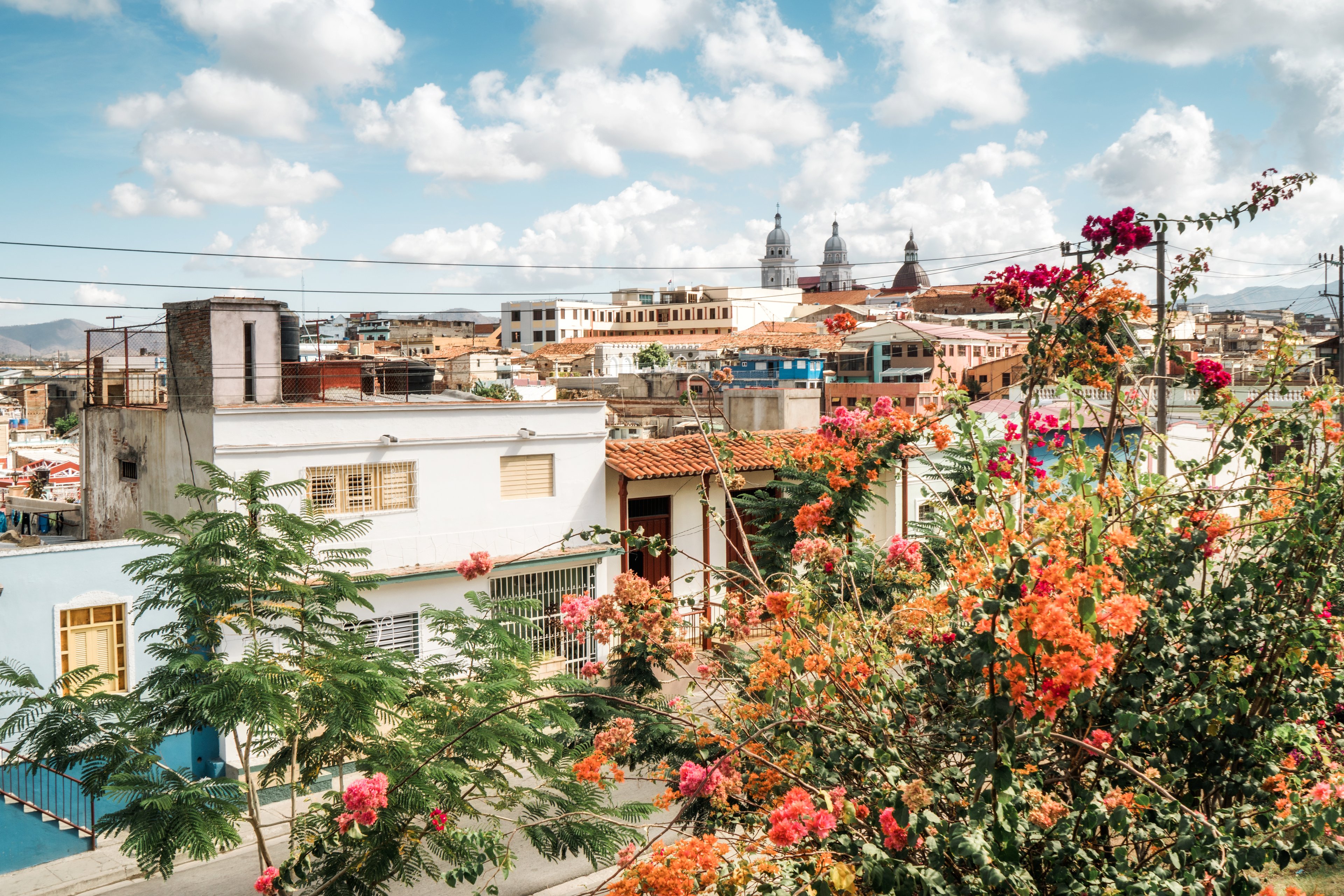 Cityscape of Santiago de Cuba, showcasing its vibrant buildings and hills