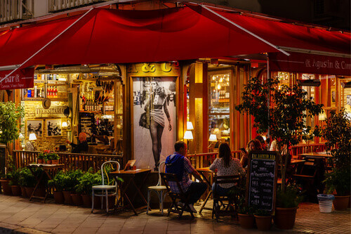 A bustling Tapas Bar in the evening, at Seville.