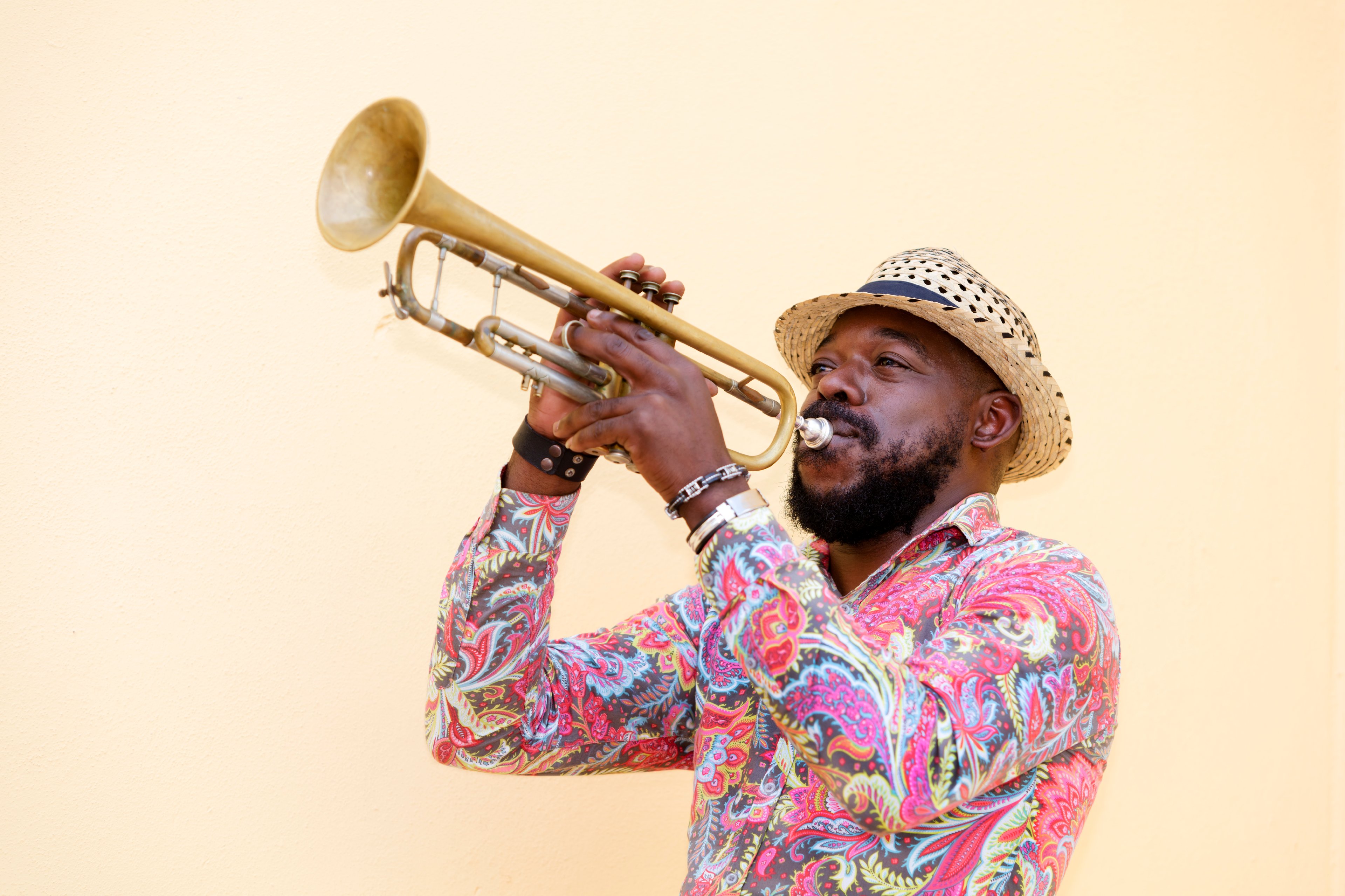 A Cuban musician plays the trumpet in the streets of Havana