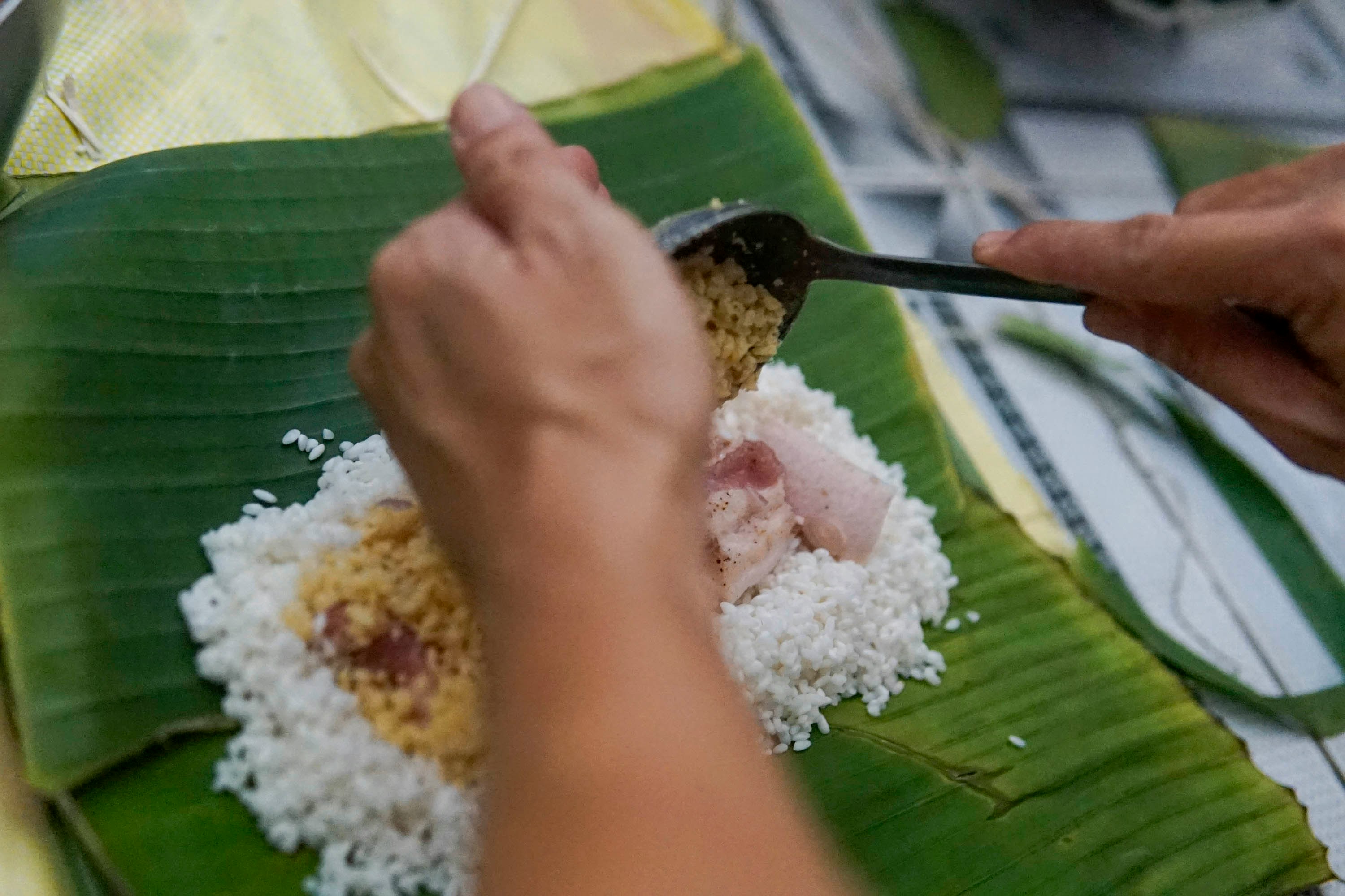 Preparation of B&aacute;nh chưng rice cakes for H&ugrave;ng Kings Festival, a symbol of Vietnamese heritage and family tradition