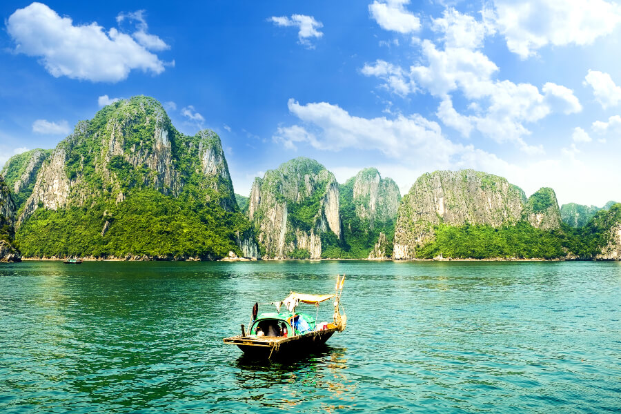 The UNESCO World Heritage Site with a boat with the view of the Karsts Isles.