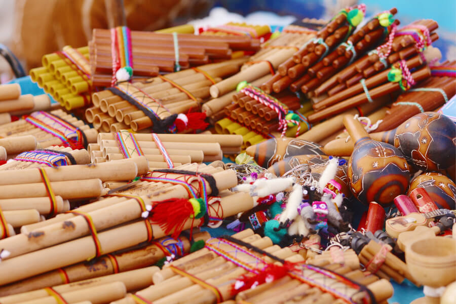 Zampona and other typical Andean musical instruments in the market.