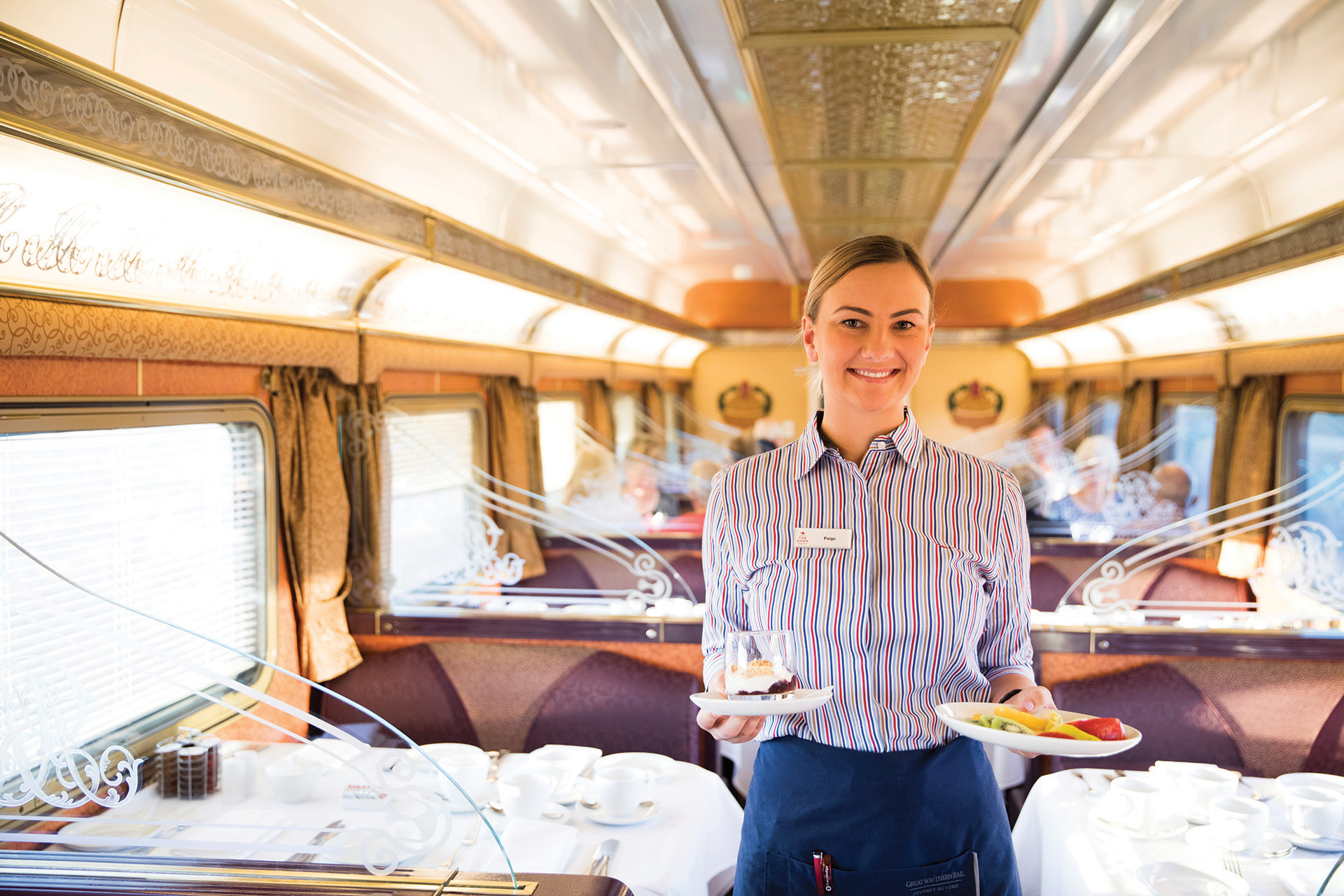 In Gold Service on The Ghan Australia, enjoy chef-prepared meals served in the elegant Queen Adelaide Restaurant carriage (Photo: Journey Beyond)