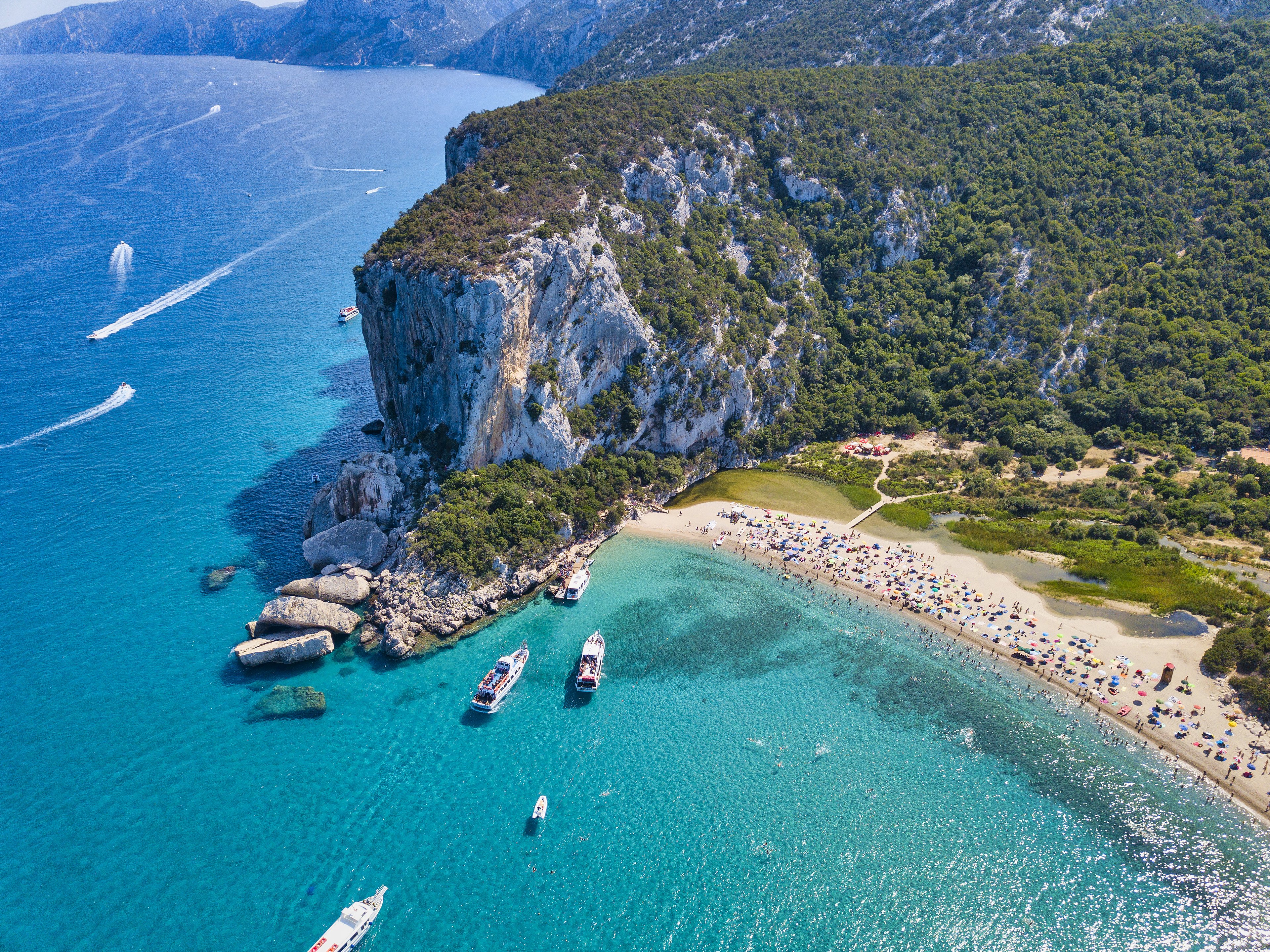 Pristine waters and dramatic cliffs at Cala Luna Beach, one of Sardinia&rsquo;s most stunning coastal gems