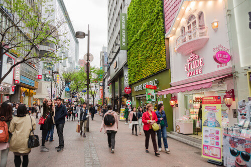 People walk through the Myeongdong commercial area in Seoul, South Korea.