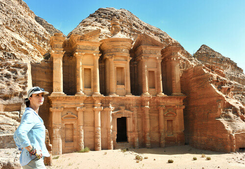 Woman outside the Ad Deir,  the Monastery Temple in Petra, Jordan.