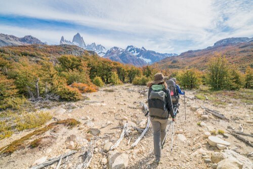 Tourists hike through the mountainside in Argentina.