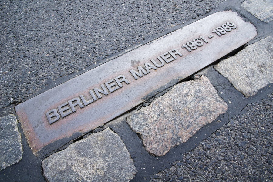 Plaque commemorating the rise and fall of the Berlin Wall that divided East and West Berlin