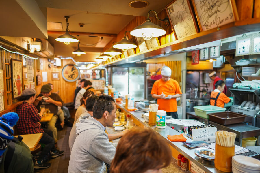 Locals at an Izakaya or pub in Dotonbori