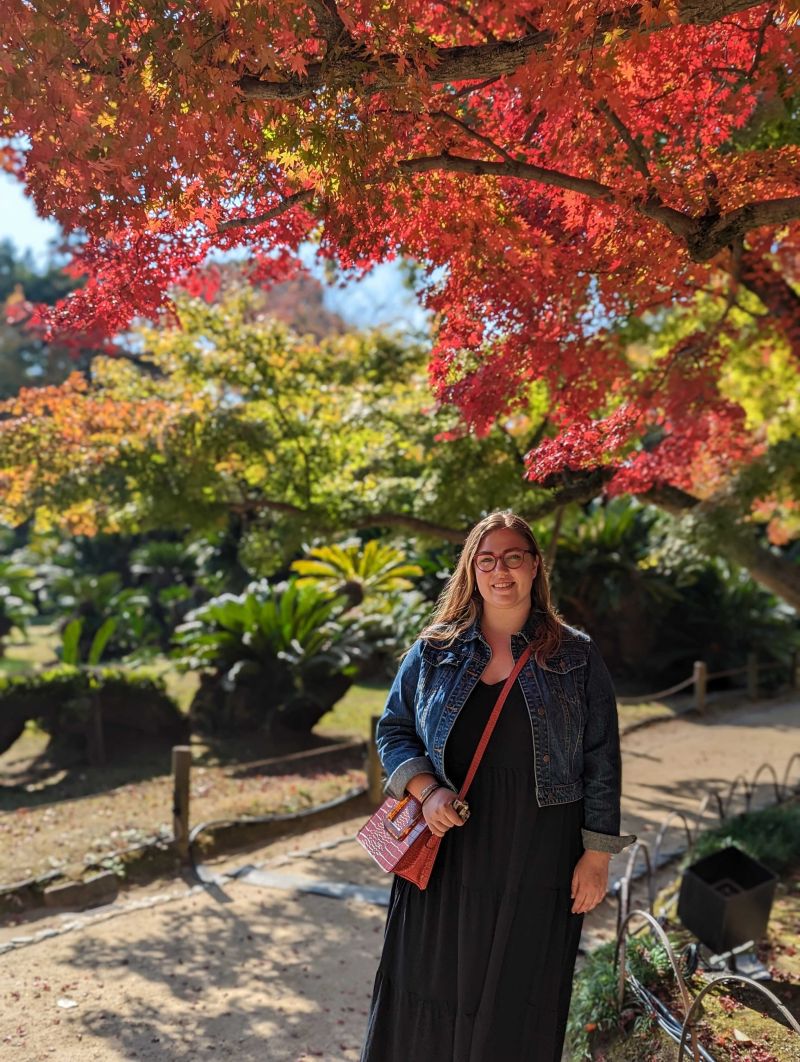 Laura in Japan during autumn foliage season, at Korakuen Garden in Okayama