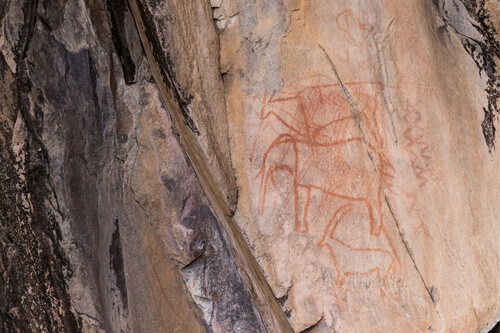 San people, or bushmans of Botswana rock paintings of animals in Chobe National Park.