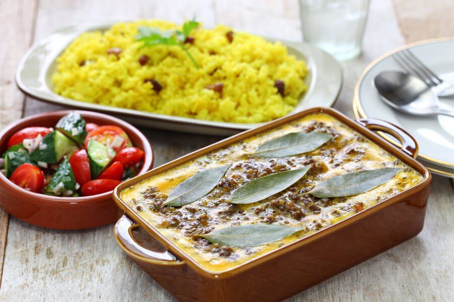 Bobotie served with yellow rice, a traditional South African dish from the Malay Cape