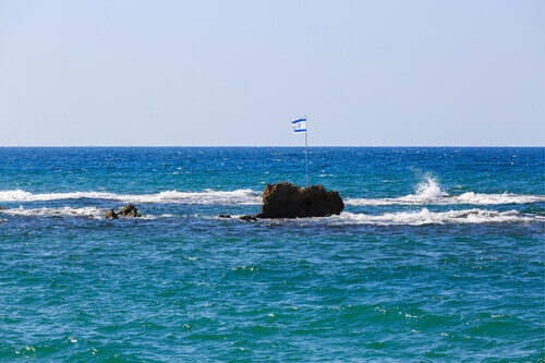 The Israeli flag on Andromedas Rock in Jaffa City, Israel.