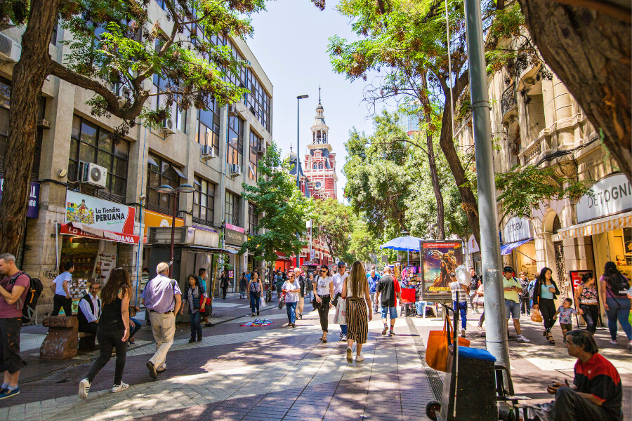 People walking on the streets of downtown Santiago on a sunny day