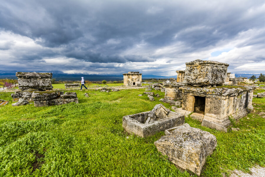Tourist walking at the necropolis or cemetery of Hierapolis.