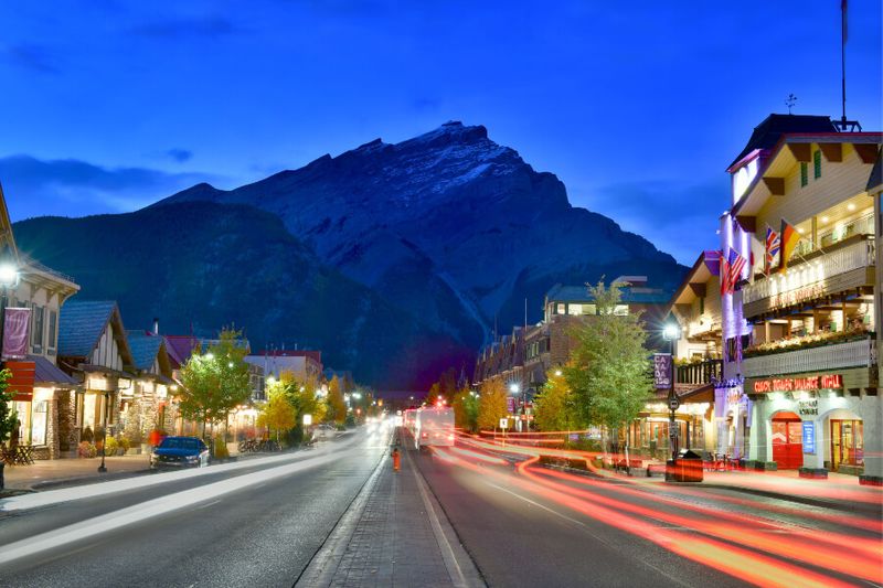 The night-time view of the famous Banff Avenue in Alberta Canada is a must-see sight.