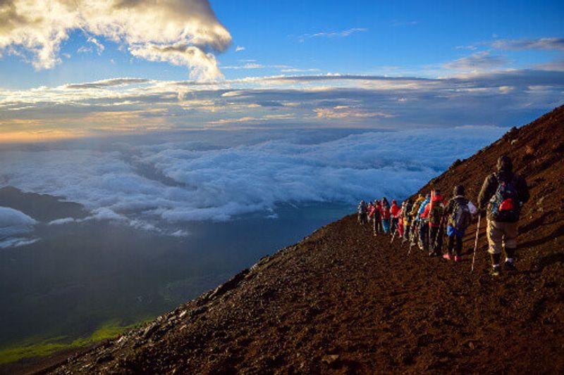 Group of people hiking in Mount Fuji in Japan