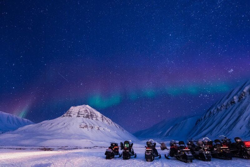 The arctic Northern Lights sky is visible in Svalbard in Norway.